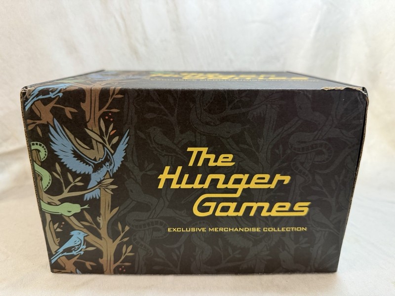 The Hunger Games Hat Exclusive Merchandise - Box, Hat, Dog tag & Stickers Only gallery